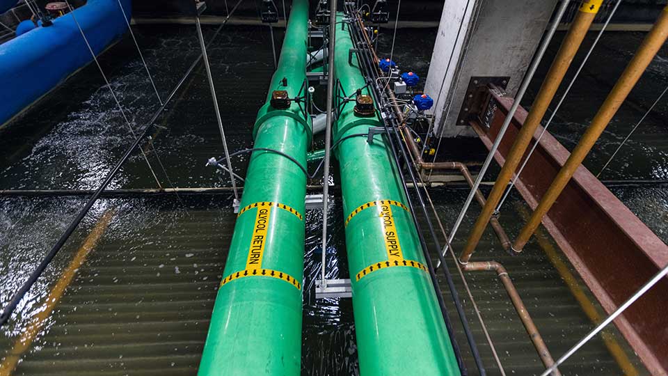 Image of pipes crossing an ice storage pool