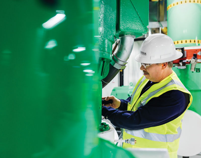 Cordia employee maintaining pipes